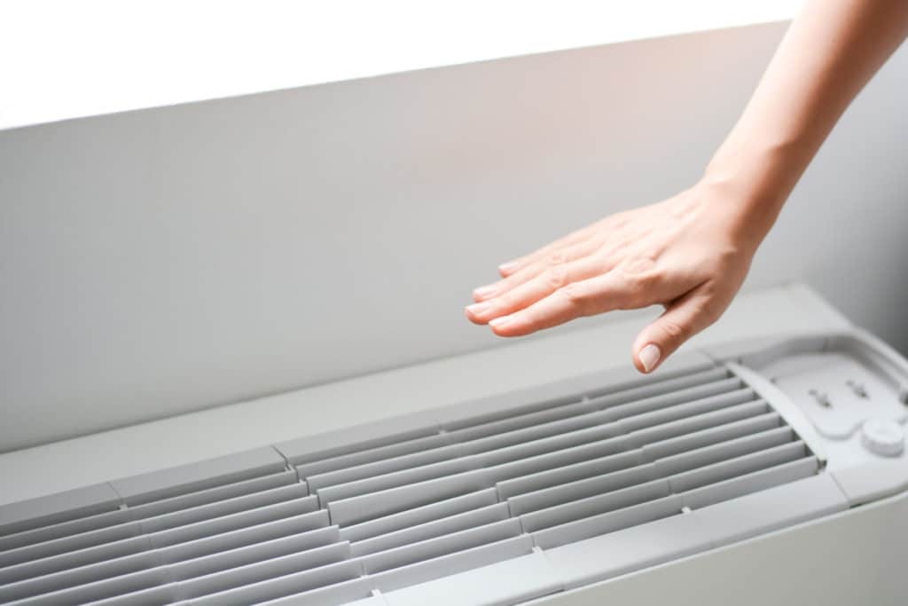 arm extended over air conditioner unit