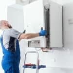 Technician installing a boiler
